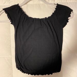 Off the shoulder, slightly cropped black shirt